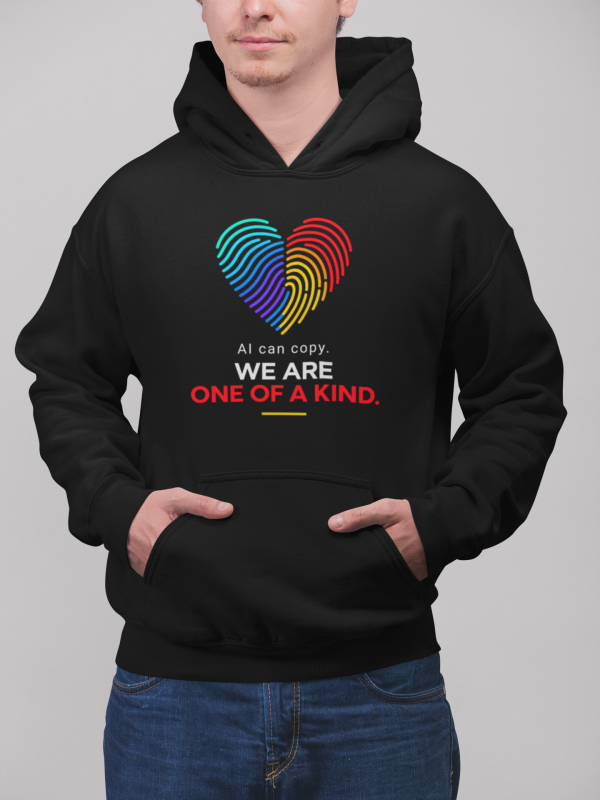 Custom Printed T Shirts - The T Shirt Man 4 โ The T Shirt Man | Next Day T Shirt Printing & Custom Hoodies Black hoodie with a rainbow heart graphic and text that reads 'AI can copy. WE ARE ONE OF A KIND.'