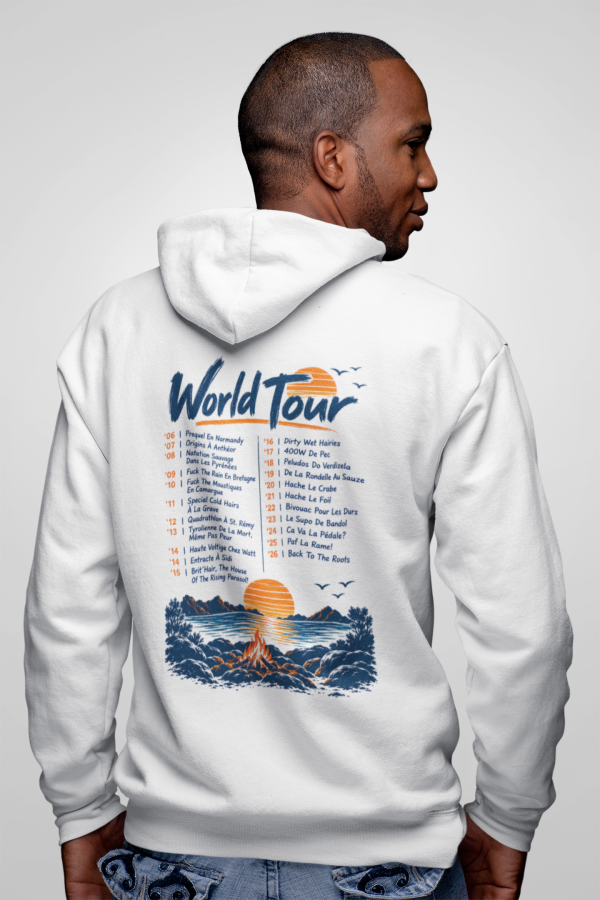 Custom Printed T Shirts - The T Shirt Man 5 โ The T Shirt Man | Next Day T Shirt Printing & Custom Hoodies Person in a white hoodie viewed from behind, revealing a large blue-and-orange 'World Tour' graphic on the back with a sunset scene and small text.